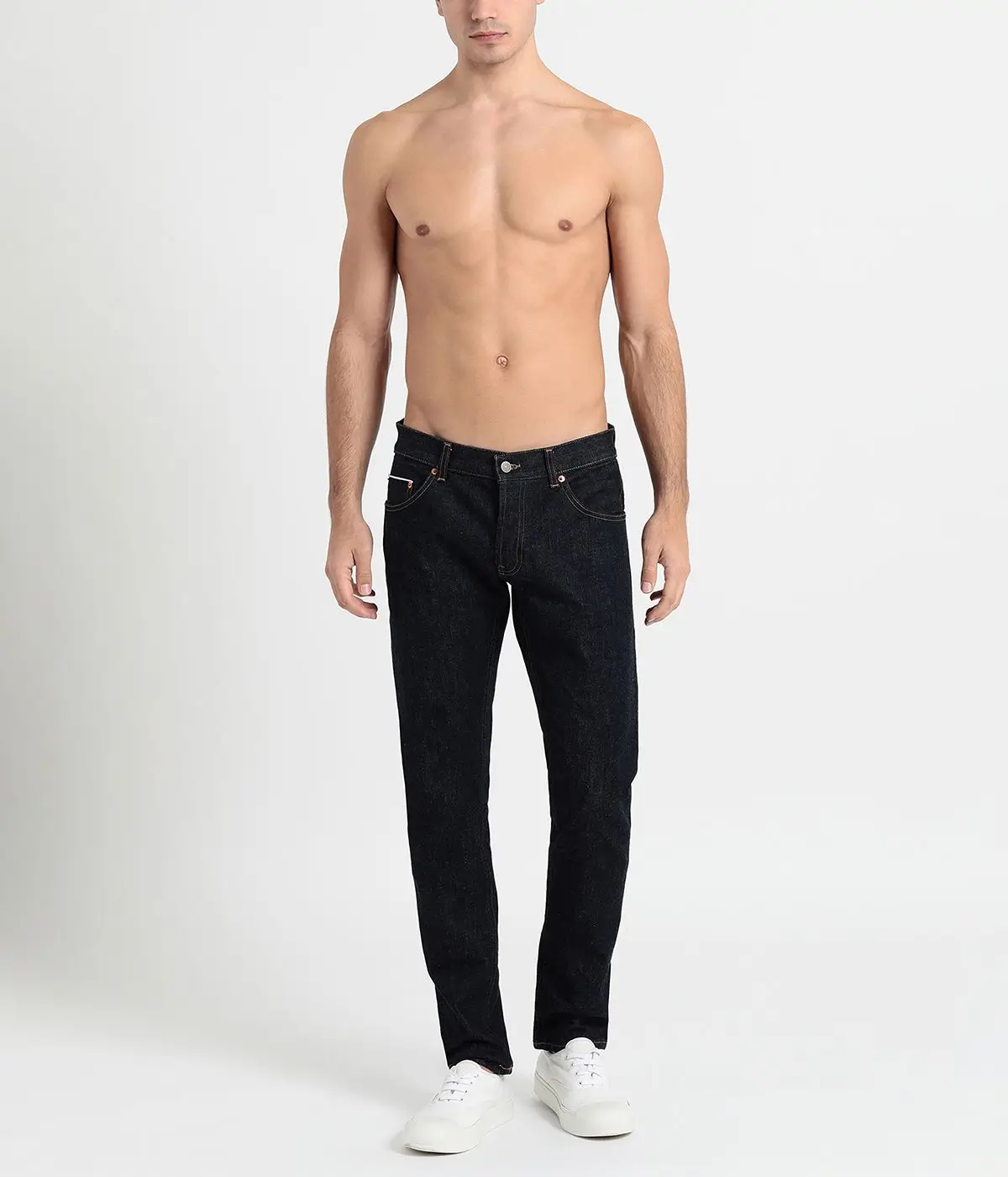 Professional e-commerce photo editing for men's fashion showing a model in black trousers