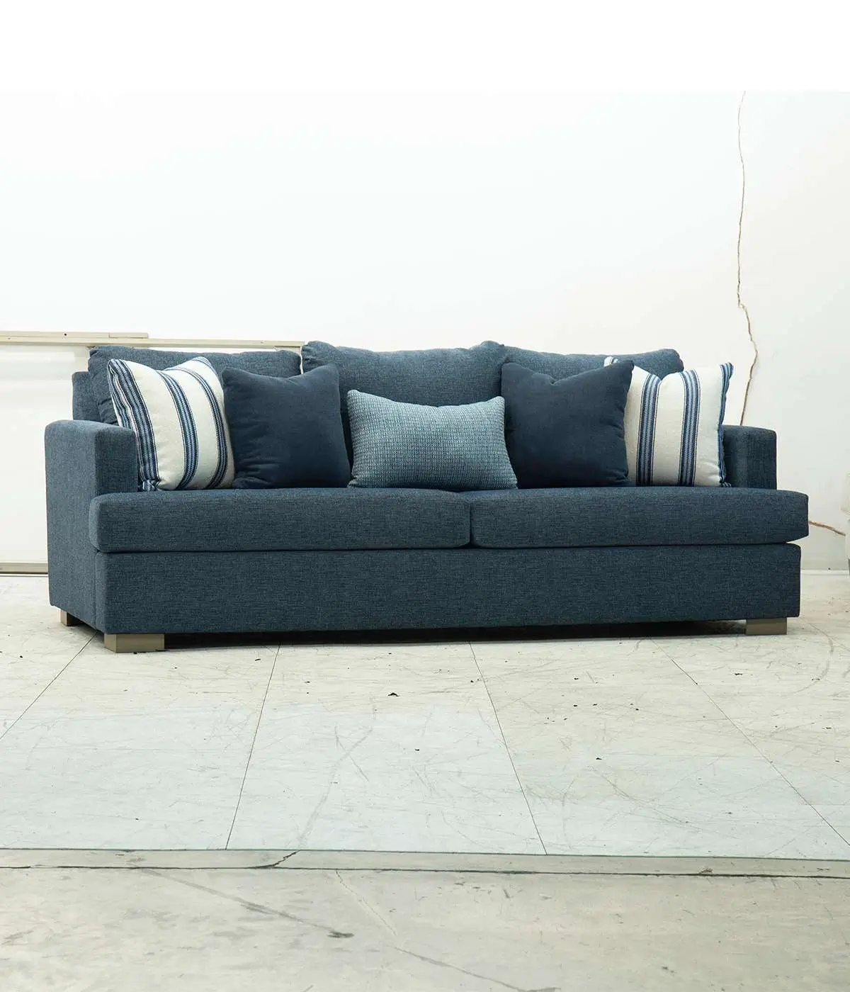 Professional natural shadow creation for furniture product photography featuring a blue sofa