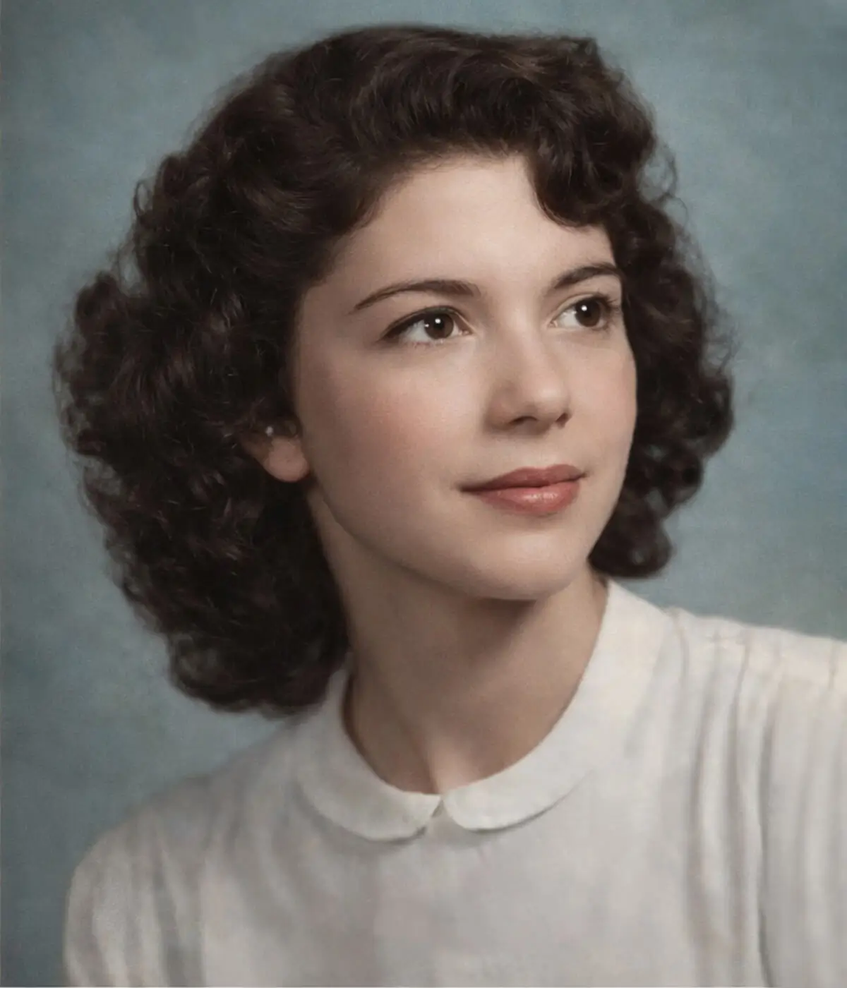 Professional old photo restoration service showing a restored vintage portrait of a woman